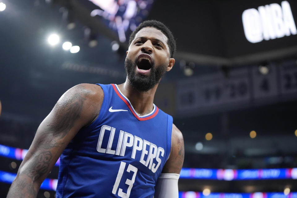 Los Angeles Clippers forward Paul George celebrates after dunking during the second half of an NBA basketball game against the Oklahoma City Thunder Tuesday, Jan. 16, 2024, in Los Angeles. (AP Photo/Mark J. Terrill)