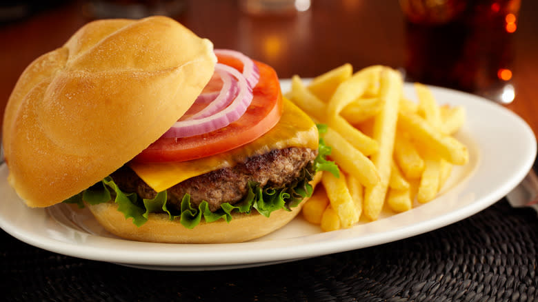 Classic burger and fries on a white platter