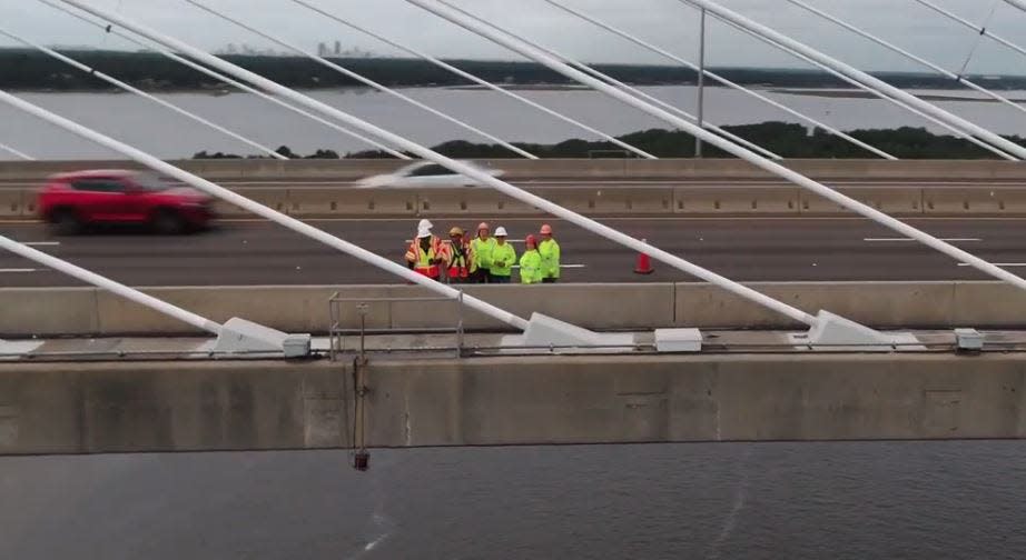 An FDOT crew conducts a 2019 inspection of the Dames Point bridge as seen in department video.