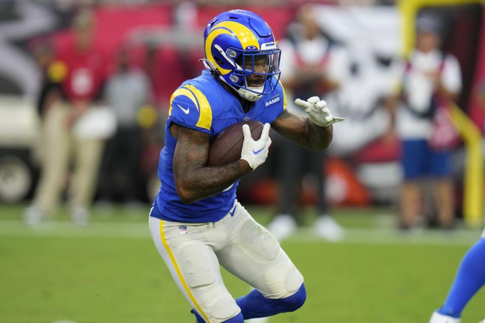 Rams running back Cam Akers carries the ball for a first down in the first half Sunday.