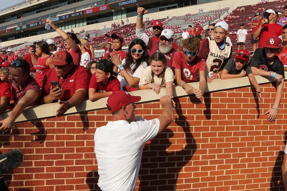 Oklahoma coach Brent Venables shakes hands with fans after Saturday's 45-13 victory over UTEP in Norman.