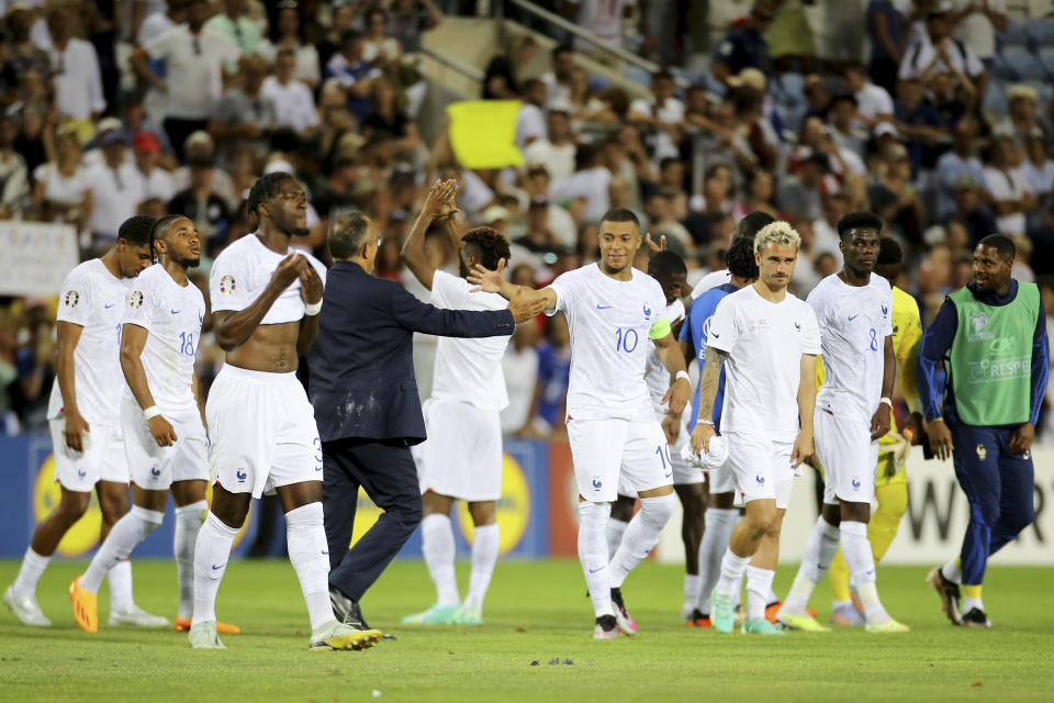 France's Kylian Mbappe, center, and his teammates leave the field at the end of the Euro 2024 group B qualifying soccer match between Gibraltar and France, at the Algarve Stadium outside Faro, Portugal, Friday, June 16, 2023. France won 3-0. (AP Photo/Joao Matos)