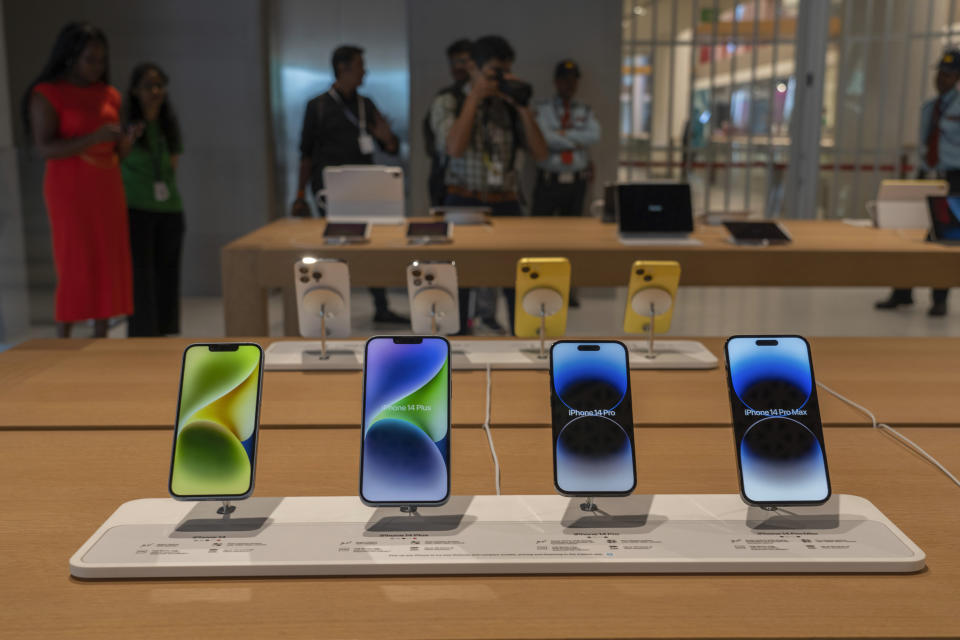 iPhones are on display during a press preview of India's first Apple Store in Mumbai, India, Monday, April 17, 2023. Apple will open its first retail store in India in Mumbai on Tuesday. (AP Photo/Rafiq Maqbool)