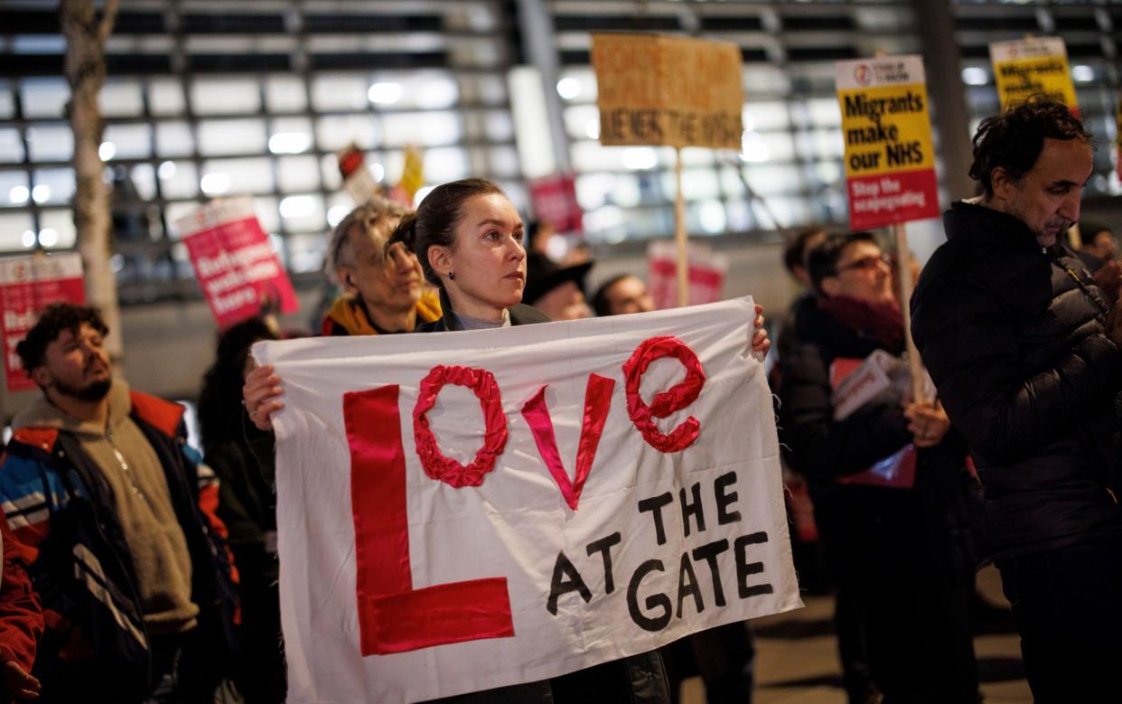 Pro-immigration campaigners protest against the Government's immigration policies at the Home Office on Dec 18