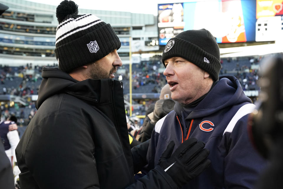 Philadelphia Eagles head coach Nick Sirianni, left, and Chicago Bears head coach Matt Eberflus meet after an NFL football game, Sunday, Dec. 18, 2022, in Chicago. (AP Photo/Nam Y. Huh)