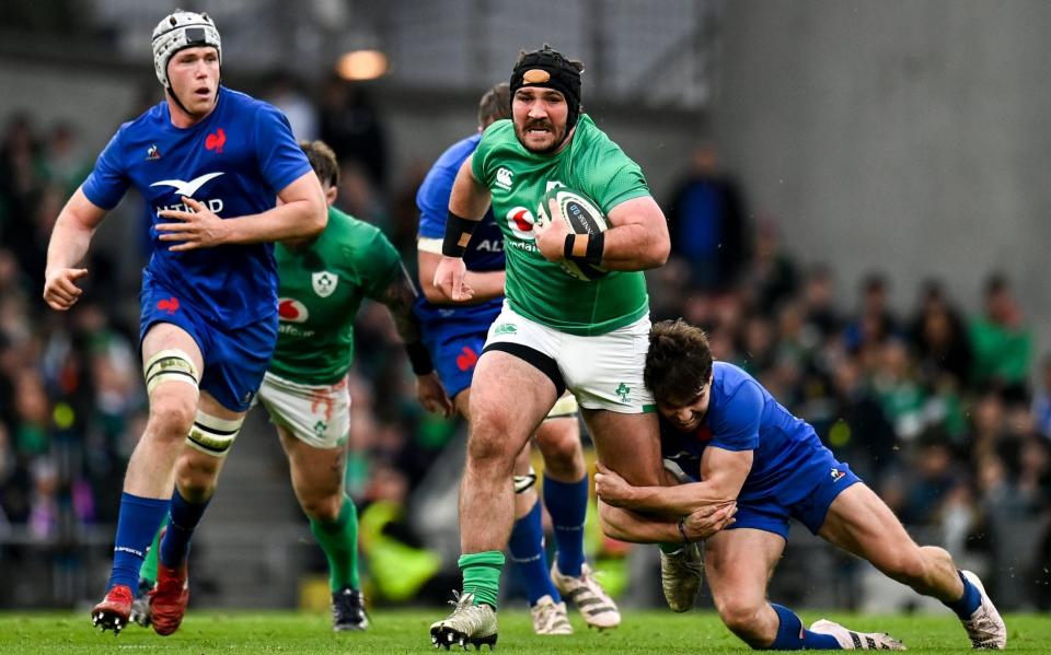 Ireland's Tom OToole is tackled by France's Antoine Dupont during the Guinness Six Nations Rugby Championship match between Ireland and France - The new World Cup crest in Ireland's armory - Harry Murphy/Sportsfile