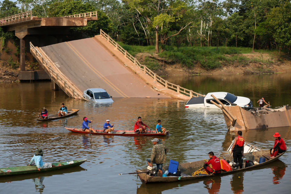Locals and rescuers search for people who plunged into the Curuca river after a bridge collapsed in the municipality Careiro Da Varzea,  Amazonas state, Brazil, on 28 September 2022.