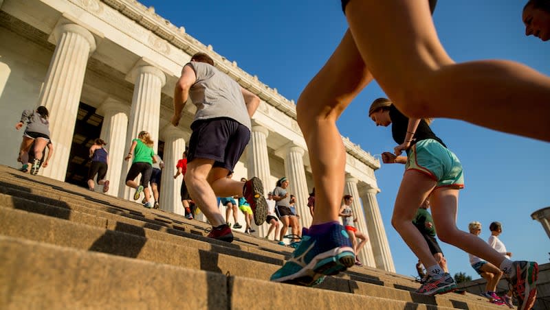 In this May 25, 2016, photo, members of the running group "November Project" run up and down the stairs of the Lincoln Memorial, in Washington. Research just presented at the European Society of Cardiology Preventive Cardiology 2024 conference finds climbing stairs is associated with longer life.
