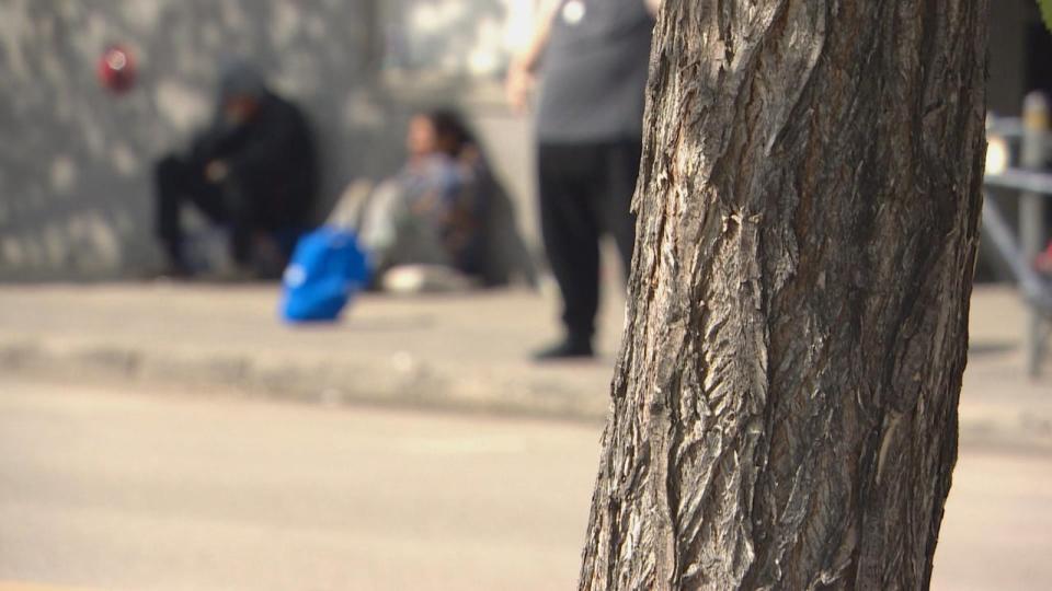 People sit outside the Salvation Army in Saskatoon, one of the locations that people are sent to from Saskatoon hospitals.