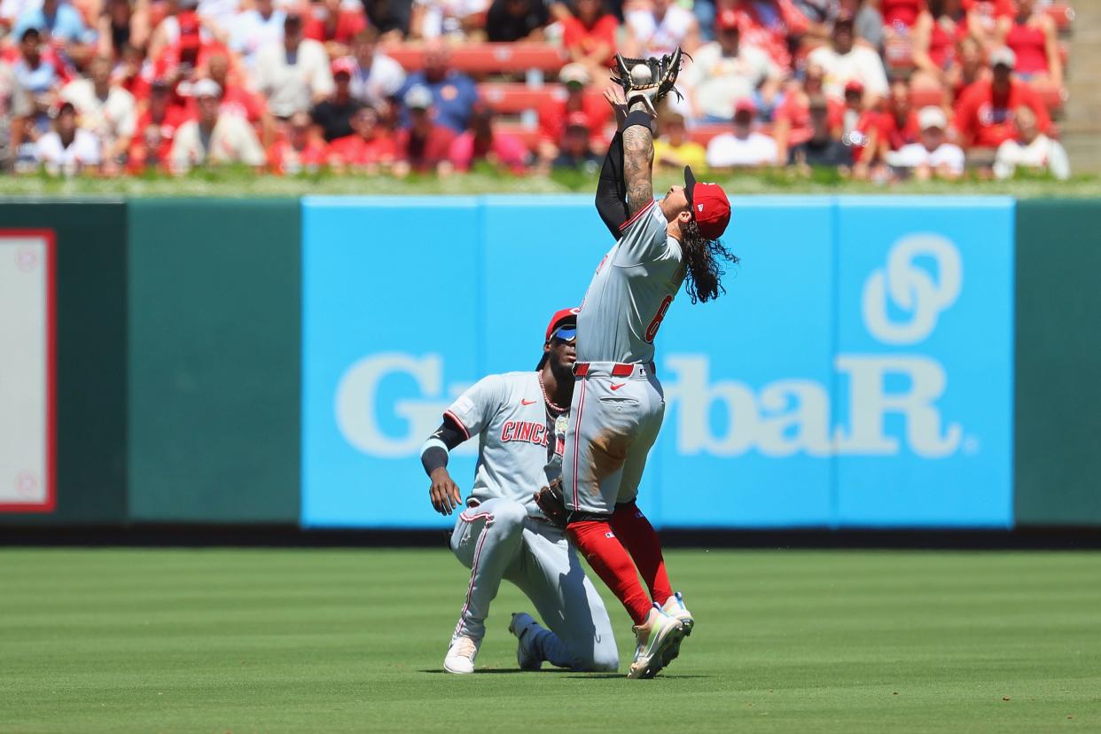 JUNE 30: Jonathan India #6 of the Cincinnati Reds catches a pop up over Elly De La Cruz #44 of the Cincinnati Reds against the St. Louis Cardinals in the third inning at Busch Stadium on June 30, 2024.