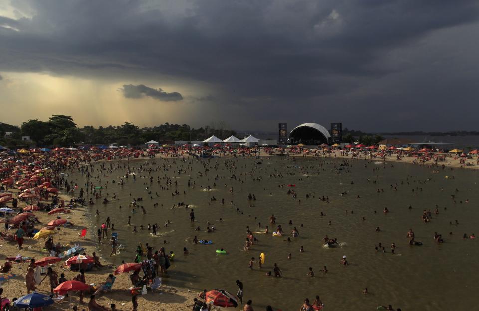 People relax at the Piscinao de Ramos artificial lake in Rio de Janeiro