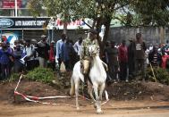 A soldier rides a horse near the Westgate shopping centre after an explosion in Nairobi, September 23, 2013. Powerful explosions sent thick smoke billowing from the Nairobi mall where militants from Somalia's al Qaeda-linked al Shabaab group threatened to kill hostages on the third day of a raid in which at least 59 have already died. (REUTERS/Karel Prinsloo)