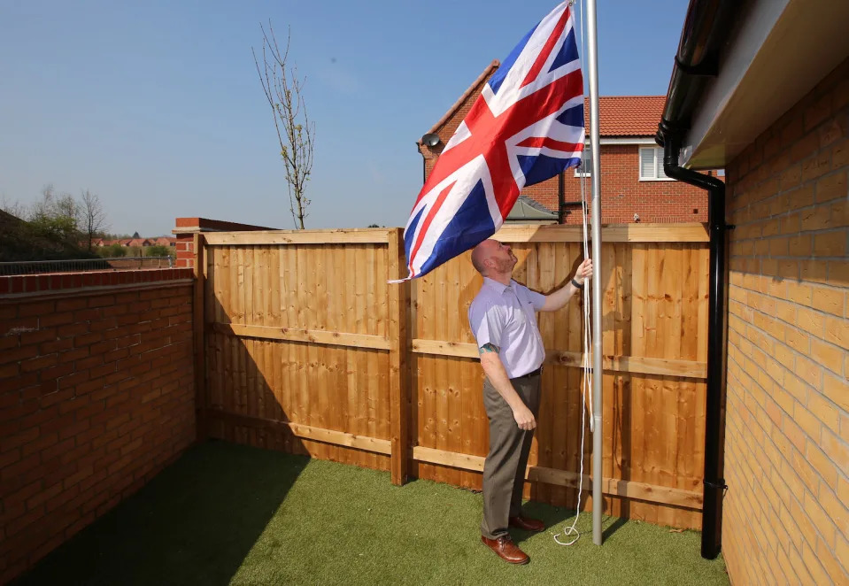 Ex-soldier Andrew Smith, 51, of Nottingham was told by a housing developer to stop flying his Union Jack flag. (SWNS)