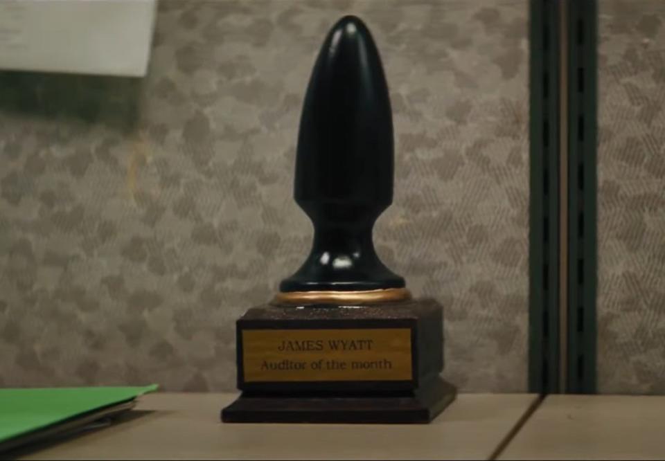 an office award shaped like a butt plug