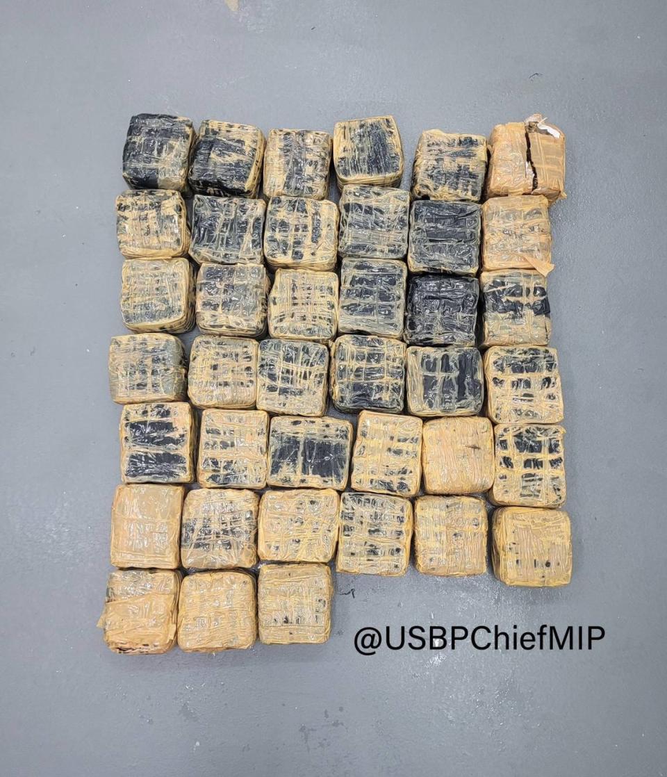 Packages of hashish are displayed on a table. The drugs were found floating at sea off Key West by a boater Saturday, Sept. 9, 2023, according to the U.S. Border Patrol.