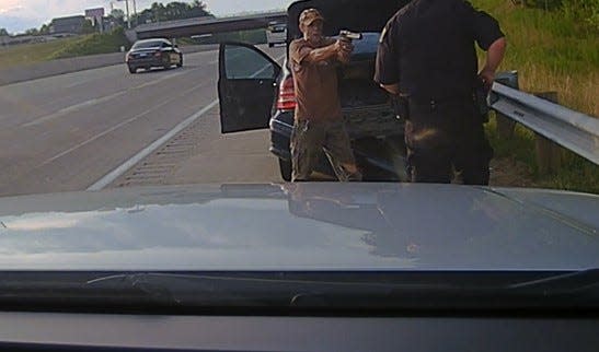 A screen capture of NCSHP dashcam from 7:35 p.m. July 3 shows Wesley Taylor, 57, of Leicester, pointing a gun at Trooper Jeffrey L. Dunlap. After being shot in the chest, Dunlap returned fire, killing Taylor.