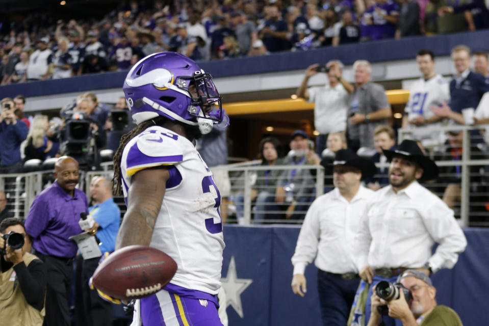 Minnesota Vikings running back Dalvin Cook (33) celebrates his rushing touchdown during the second half of the team's NFL football game against the Dallas Cowboys in Arlington, Texas, Sunday, Nov. 10, 2019. (AP Photo/Michael Ainsworth)