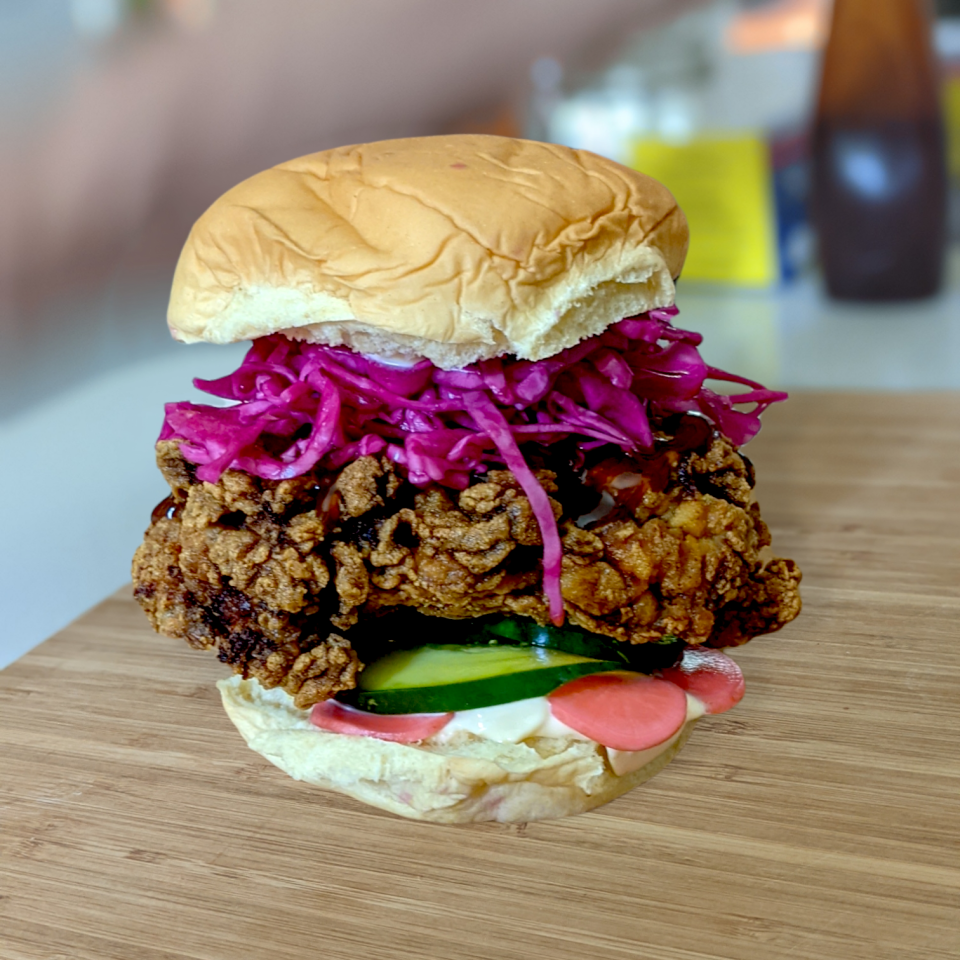 Florence and the Spice Boys, known for modern Middle Eastern fusion street food such as the turmeric fried chicken sandwich pictured here, plans to open a second location at University Town Center in fall 2024.