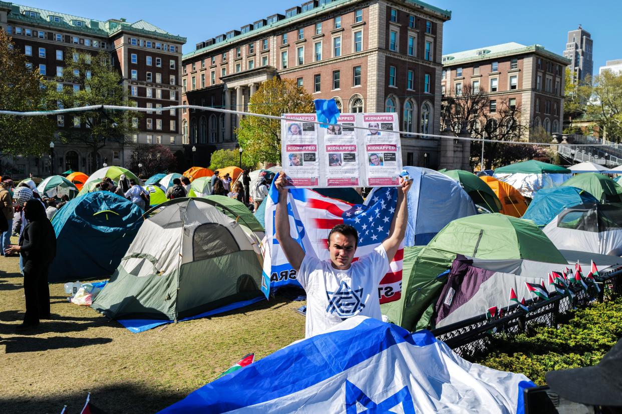 A pro-israel protester stands in the pro Palestian encampment on the campus of Columbia University in New York City on April 23, 2024.