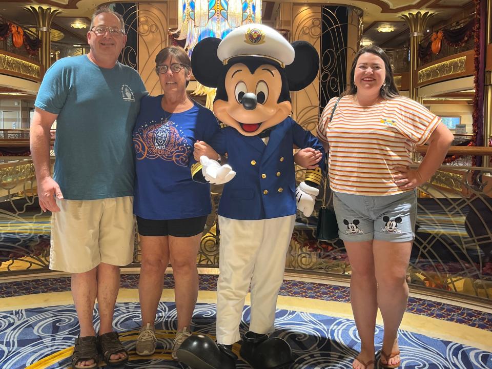 duBois family posing on disney dream with mickey mouse