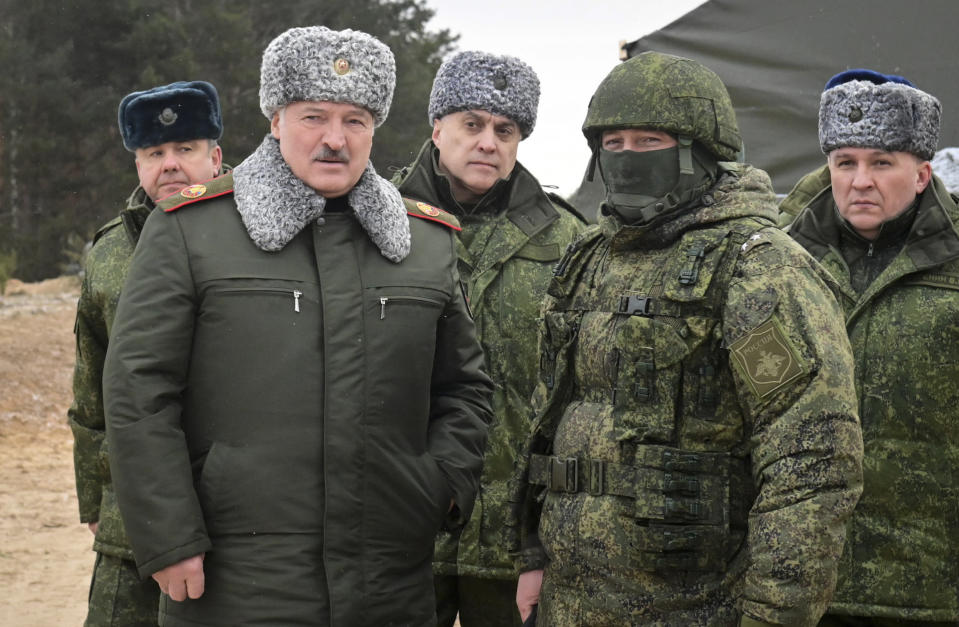 Belarusian President Alexander Lukashenko, second left, speaks during his meeting with military top officials at the Obuz-Lesnovsky training ground, Belarus, Friday, Jan. 6, 2023. After Russia invaded Ukraine, guerrillas from Belarus began carrying out acts of sabotage on their country's railways, including blowing up track equipment to paralyse the rails that Russian forces used to get troops and weapons into Ukraine. Belarusian Defense Minister Viktor Khrenin is on right, and the State Secretary of the Security Council Alexander Volfovich is in centre. (Andrei Stasevich/BelTA Pool Photo via AP)