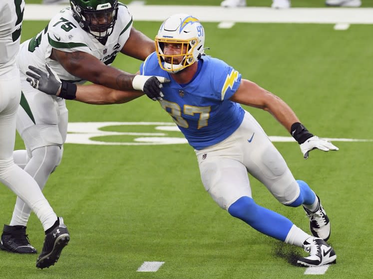 Los Angeles Chargers defensive end Joey Bosa (97) chases the quarterback during an NFL football game against the New York Jets, Sunday, November 22, 2020 in Inglewood, Calif. The Chargers defeated the Jets 34-28. (John Cordes/AP Images for Panini)