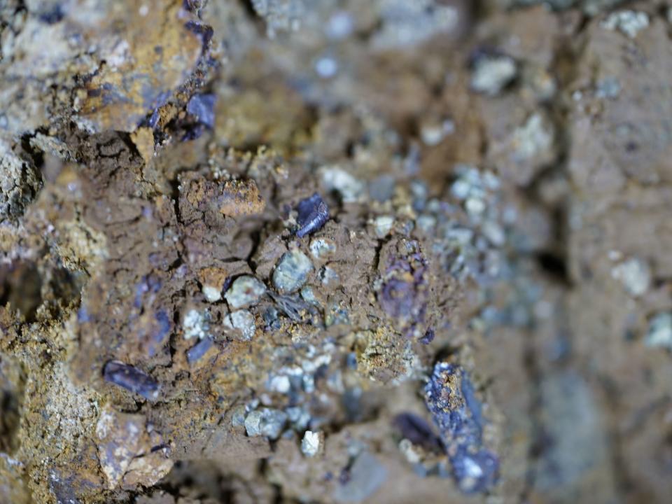 fragments from the impact of the meteorite can be seen encased in dirt.