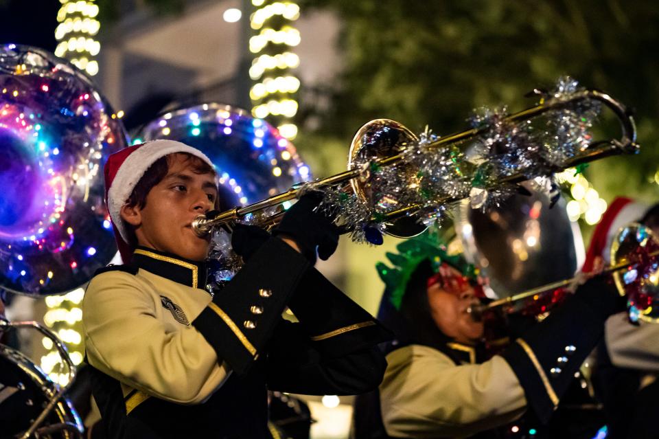 Members of the Golden Gate High School band perform during the Fifth Avenue South Christmas parade in Naples on Tuesday, Dec. 5, 2023.