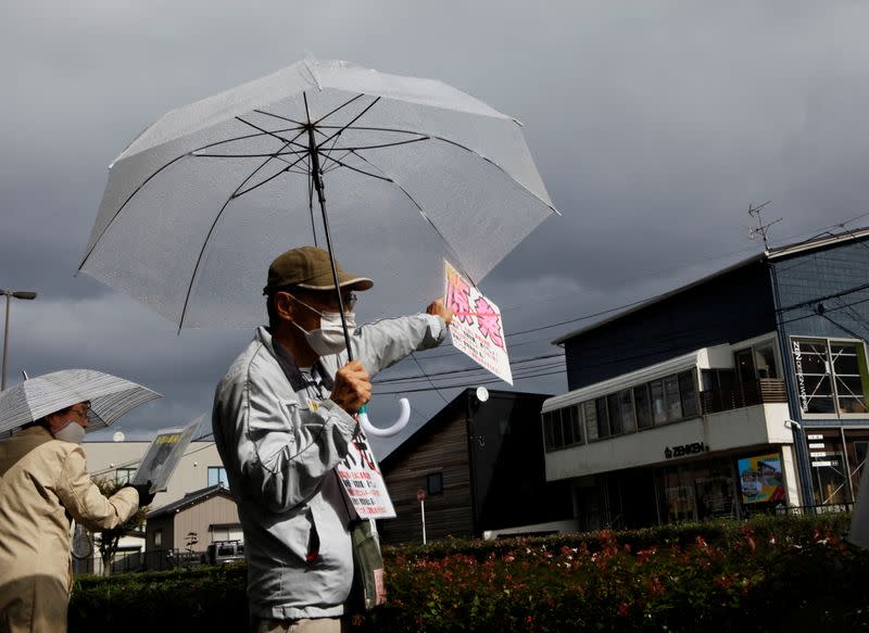 FILE PHOTO: An anti-nuclear activist demonstrates in front of the Tokyo Electric Power Company Holdings office in Niigata