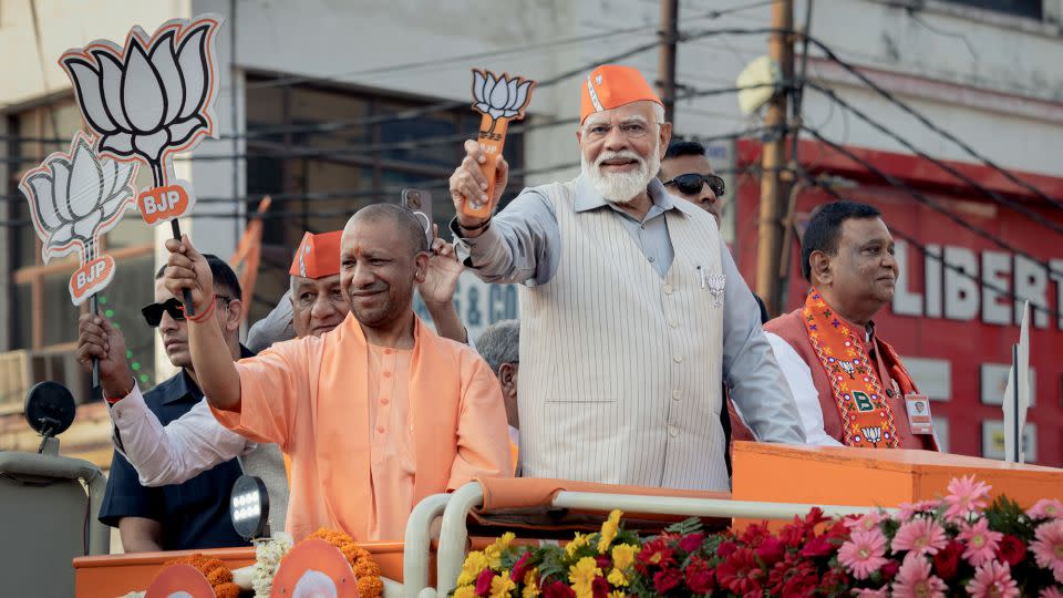 Prime Minister Narendra Modi greets supporters at a roadshow on April 6 in Ghaziabad, Uttar Pradesh. India's general election, with almost 970 million registered voters, is a mammoth undertaking lasting 6 weeks. - Elke Scholiers/Getty Images