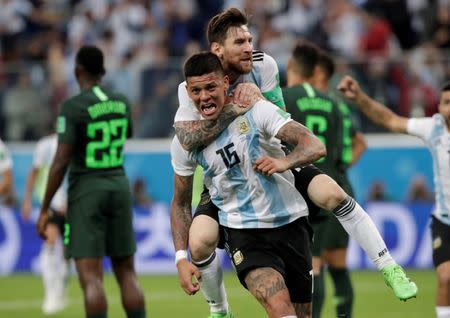 Soccer Football - World Cup - Group D - Nigeria vs Argentina - Saint Petersburg Stadium, Saint Petersburg, Russia - June 26, 2018 Argentina's Marcos Rojo celebrates scoring their second goal with Lionel Messi REUTERS/Henry Romero