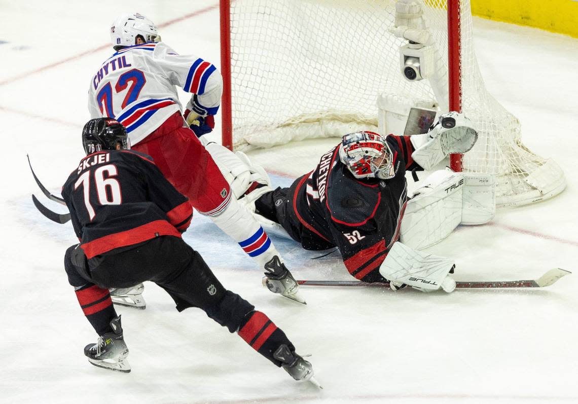 Carolina Hurricanes goaltender Pyotr Kochetkov (52) stops a scoring attempt by New York Rangers center Fillip Chytil (72) in the third period of Game 3 in the second round of the 2024 Stanley Cup playoffs on Thursday, May 9, 2024 at PNC Arena, in Raleigh N.C.