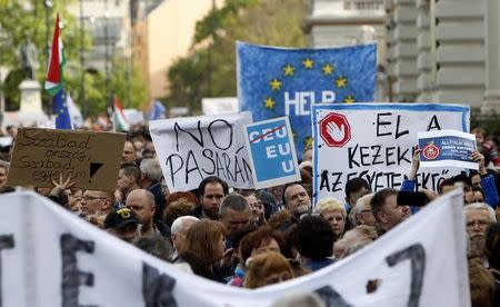 People protest against the bill that would undermine Central European University, a liberal graduate school of social sciences founded by U.S. financier George Soros in Budapest, Hungary, April 9, 2017. REUTERS/Bernadett Szabo