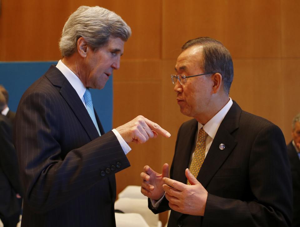 U.S. Secretary of State Kerry talks to U.N. Secretary-General Ban Ki-moon prior to peace talks in Montreux