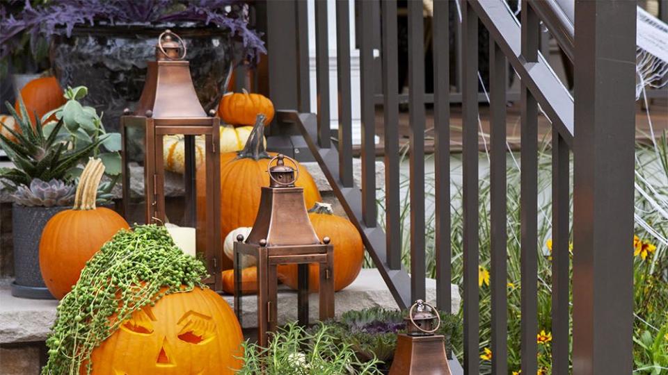 pumpkin carving ideas crazy hair jack o 'lanterns lined up on stone stairs