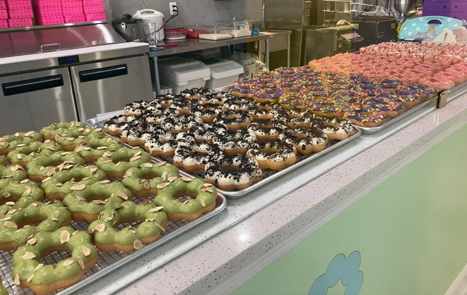 Trays of freshly made Mochi donuts line the display case at newly opened Mochinut, a Los Angeles-based Asian-style bakery and cafe that debuted Saturday, March 2, 2024 at 11757 Unit 9 in Jacksonville.