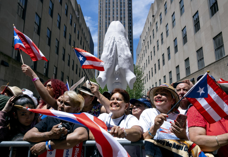 Spectators take part in the National Puerto Rican Day Parade Sunday, June 9, 2019, in New York. (AP Photo/Craig Ruttle)