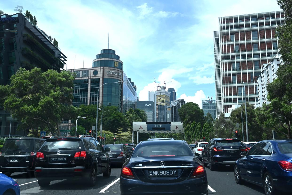 Motorists wait at a traffic junction to enter the central business district in Singapore on June 4, 2020, as Singapore eases its partial lockdown restrictions aimed at curbing the spread of the COVID-19 novel coronavirus. (Photo by Roslan RAHMAN / AFP) (Photo by ROSLAN RAHMAN/AFP via Getty Images)