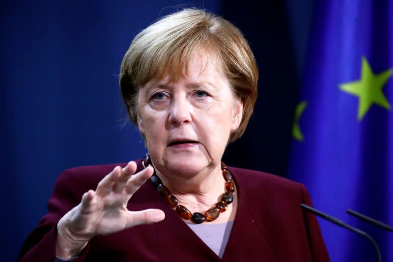 German Chancellor Merkel and FM Scholz hold news conference in Berlin