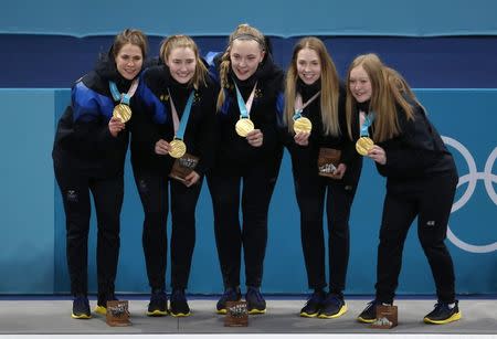 Curling - Pyeongchang 2018 Winter Olympics - Women's Final - Sweden v South Korea - Gangneung Curling Center - Gangneung, South Korea - February 25, 2018 - Gold medallists Anna Hasselborg of Sweden, and her teammates, Sara McManus, Agnes Knochenhauer, Sofia Mabergs and Jennie Waahlin pose during the victory ceremony. REUTERS/Cathal Mcnaughton