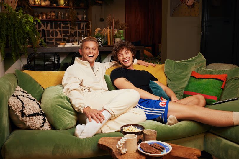 Jeff Brazier and Bobby Brazier on their couch at home