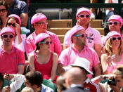 <p>Tennis fans dressed in pink watch the Gentlemen's Singles third round match between Bernard Tomic of Australia and Richard Gasquet of France on Centre Court during day six of the Wimbledon Lawn Tennis Championships at the All England Lawn Tennis and Croquet Club on June 29, 2013 in London, England.</p>