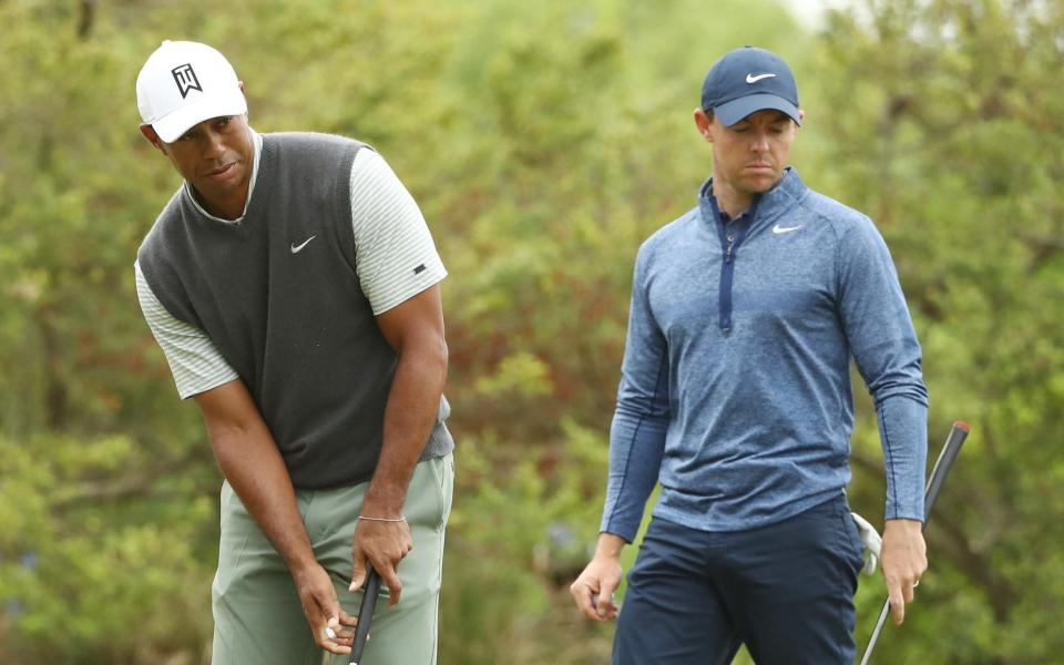 Tiger Woods sinks his putt to defeat Rory McIlroy - Getty Images North America