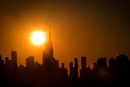 The sun sets on midtown Manhattan during a blackout in New York