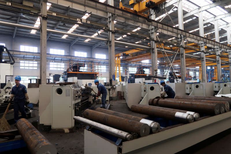 Employees work at Jingjin filter press factory in Dezhou