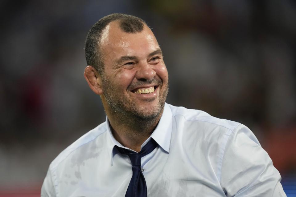 Argentina's head coach Michael Cheika celebrates at the end of the Rugby World Cup quarterfinal match between Wales and Argentina at the Stade de Marseille in Marseille, France, Saturday, Oct. 14, 2023. (AP Photo/Pavel Golovkin)