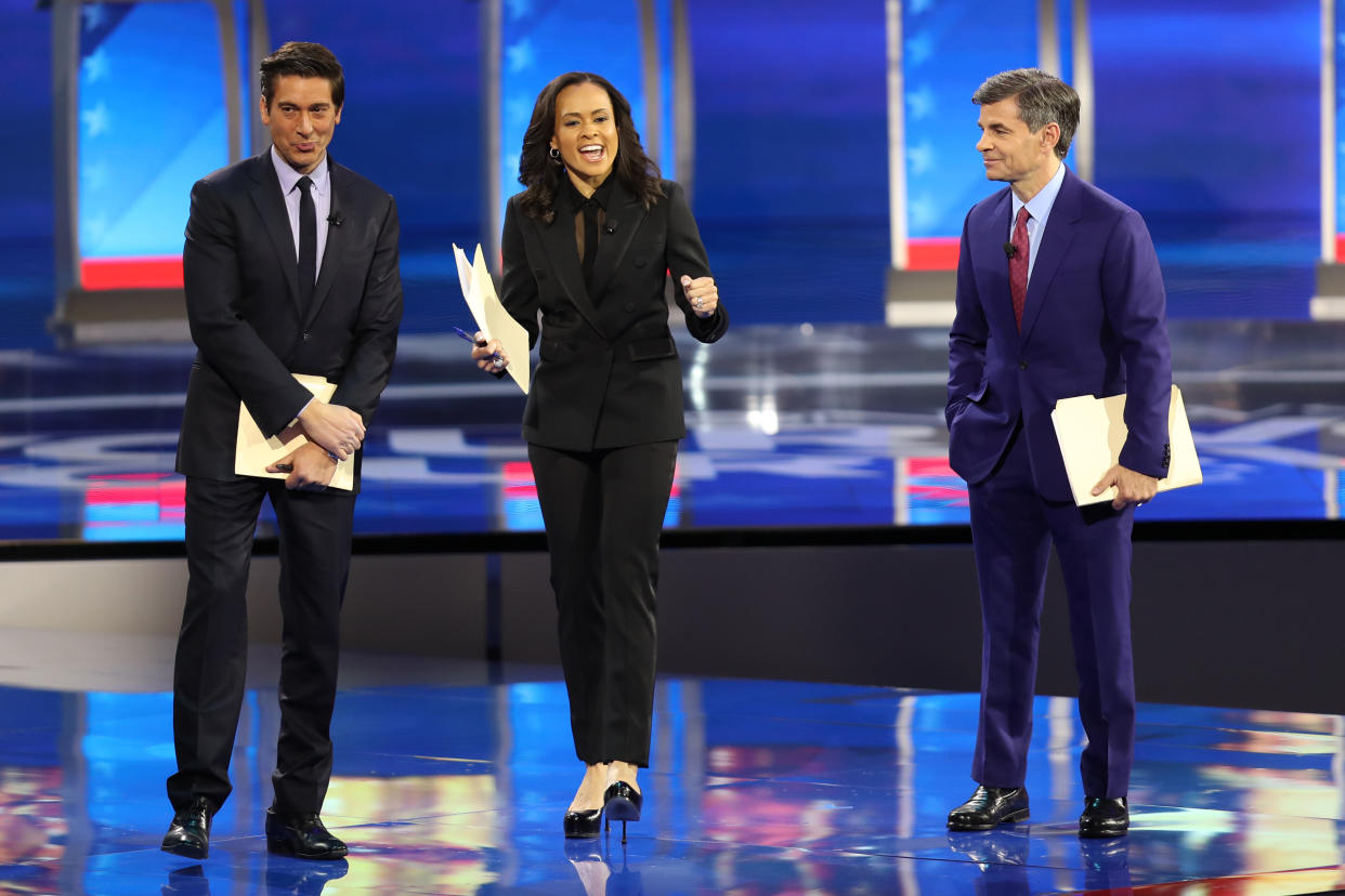 David Muir, Linsey Davis and George Stephanopoulos onstage before a debate.