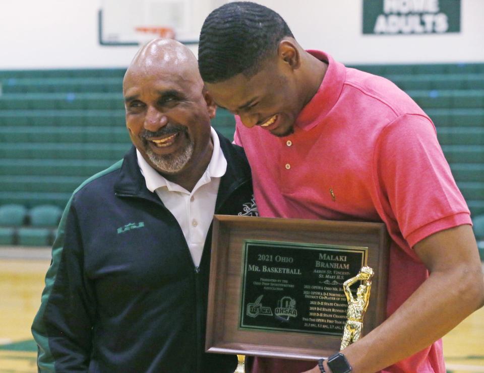 St. Vincent - St. Mary's head coach Dru Joyce II shares a laugh with Malaki Branham after receiving the 2021 Ohio Mr. Basketball award at the school on Thursday, April 8, 2021.