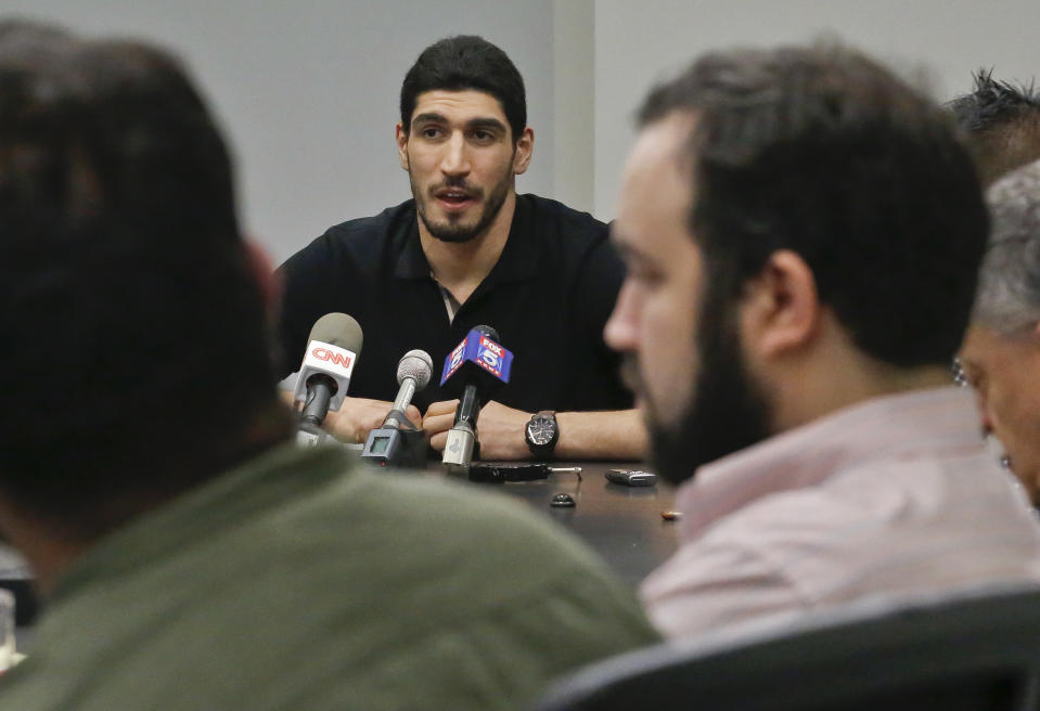 Enes Kanter speaks about being detained at an airport in Bucharest, Romania, during a press conference in May. (AP)