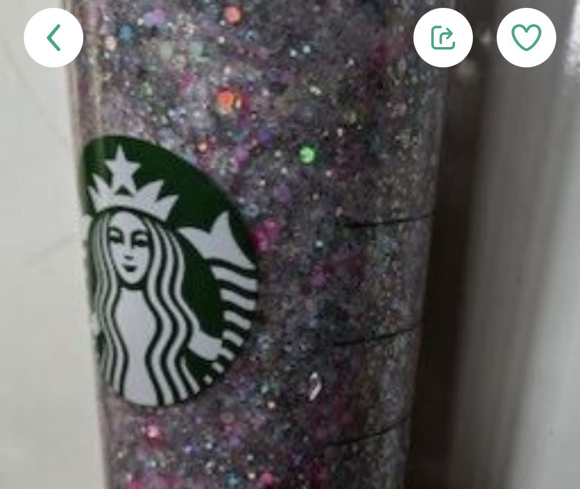 a starbucks snow globe cup